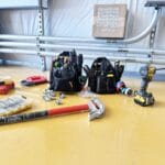 Technician diagnosing a home solar inverter and battery system in Sacramento — Menderix solar service & troubleshooting